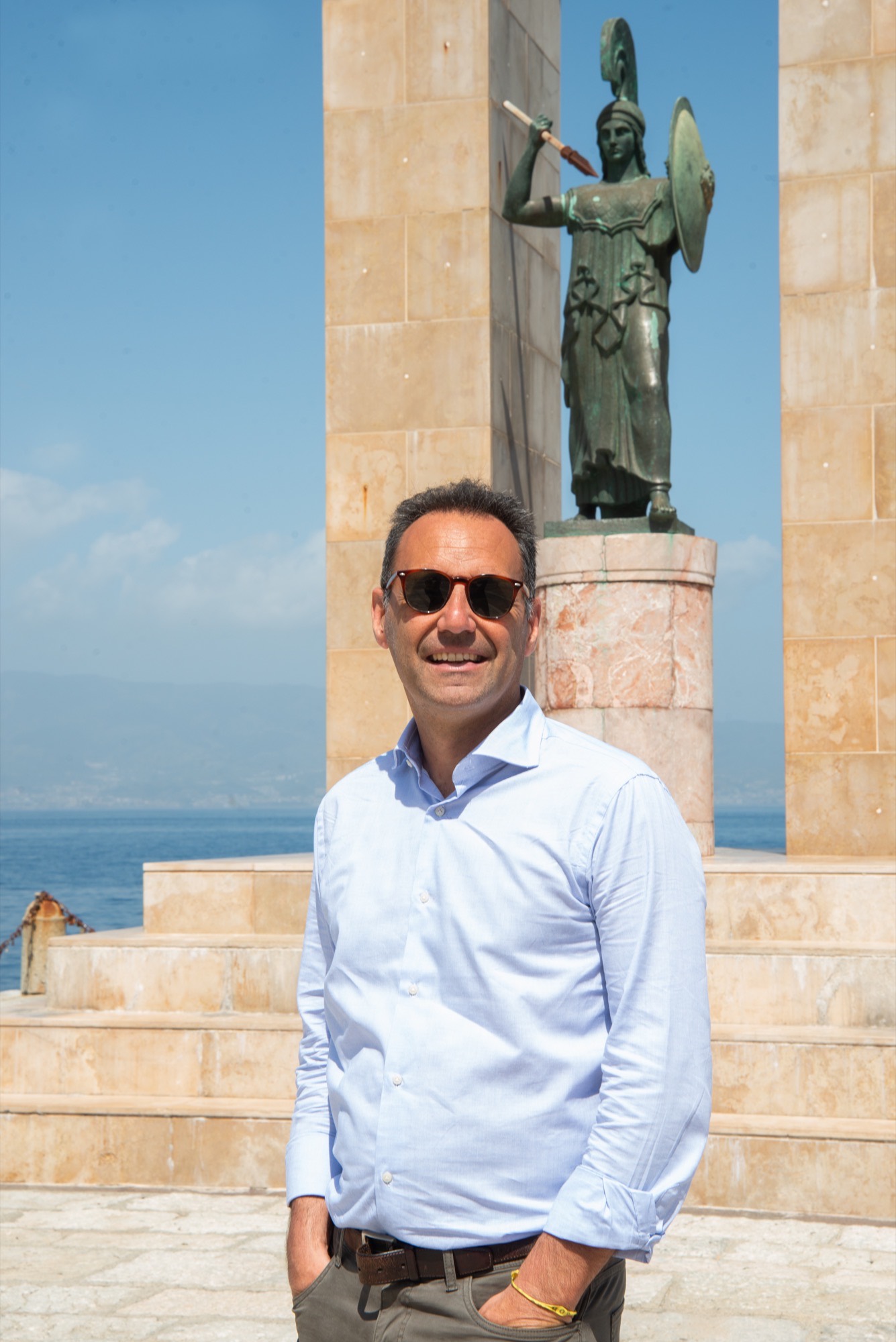 Fabrizio in Calabria with the Athene Promachos monument behind him