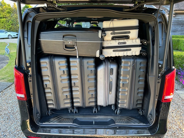Mercedes-Benz Vito luggage area filled with large and cabin bags